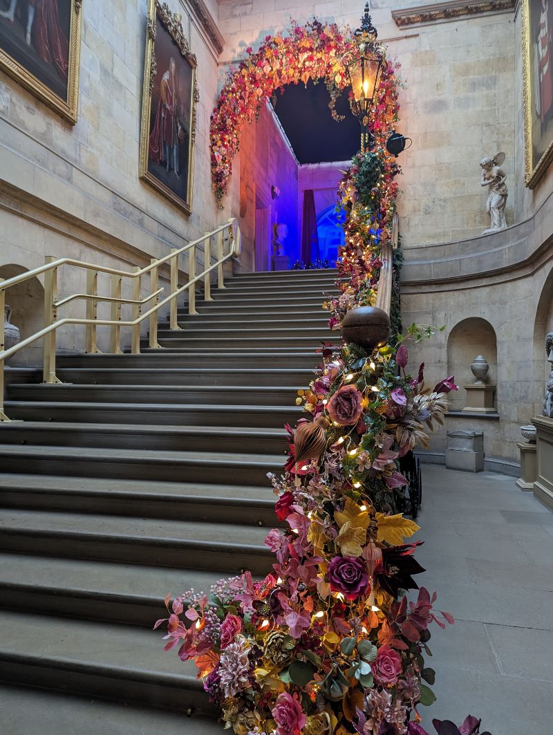 The grand staircase decorated for Christmas at Castle Howard